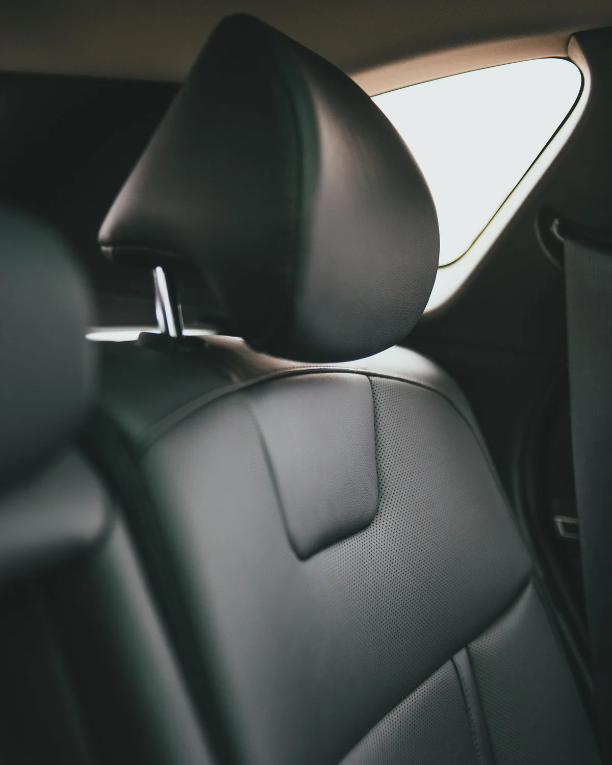 Clean back seat of the Clevs Toyota Camry Hybrid used for private transfers in Nowra